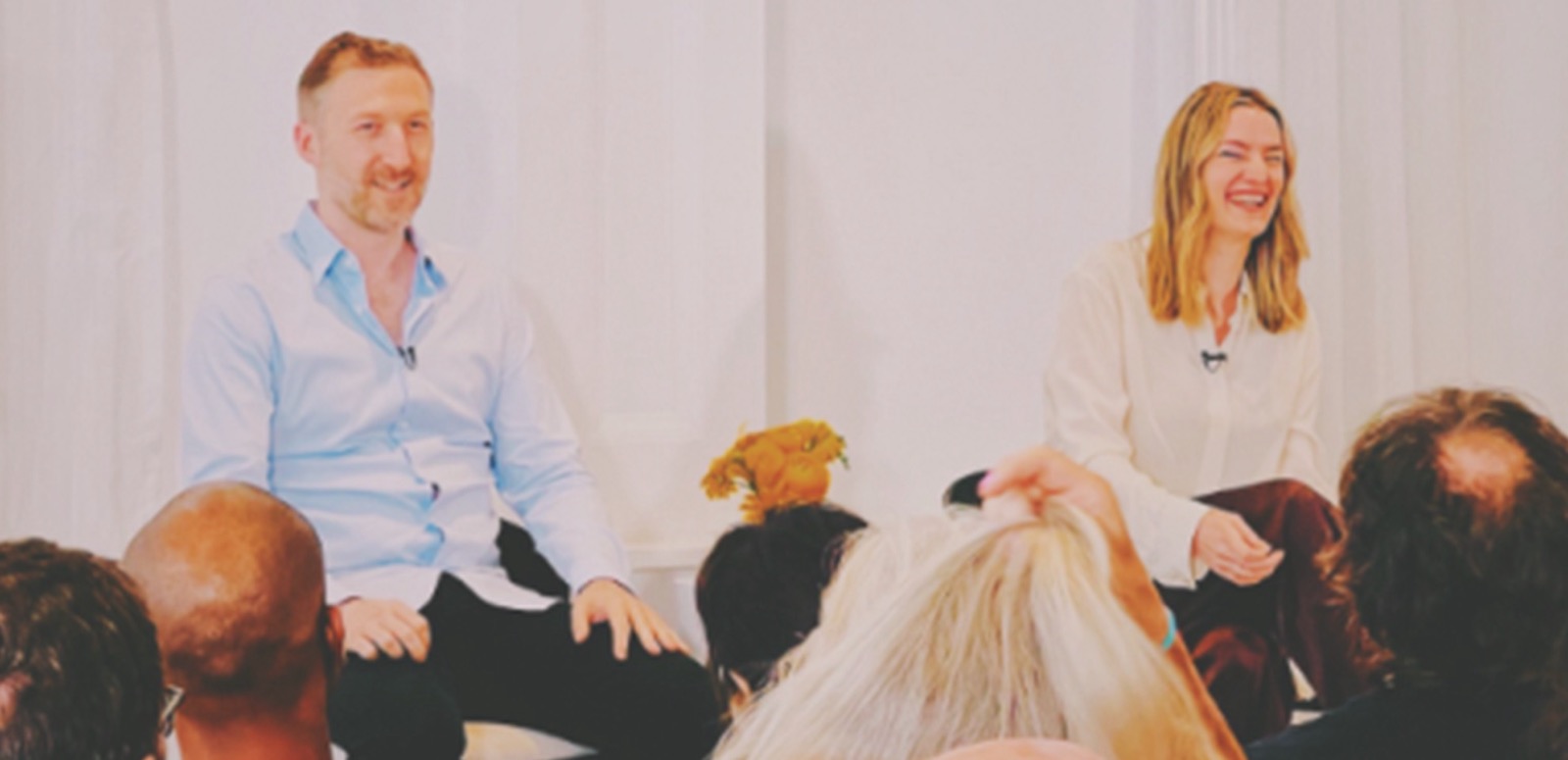 Eros Academy instructors teaching a seated group
